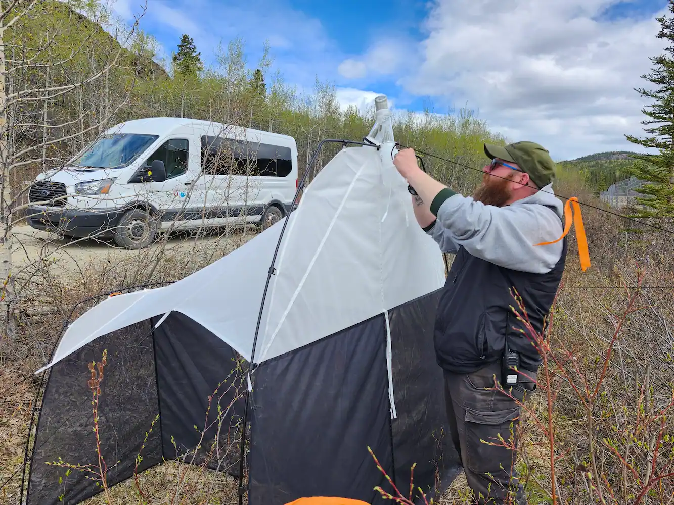 Bug Questing at the YWP Photo of YWP staff working on installing fencing.